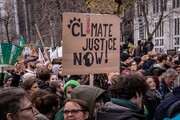 Klimaatmars Brussel, met tekst &#34;Climate Justice Now!&#34;