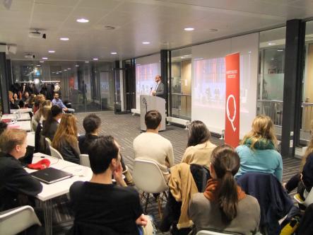 The audience listens attentively to Gideon Shimshon