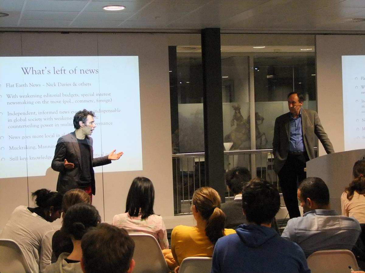 The audience listens attentively to Marc Chavannes and Arco Timmermans 
